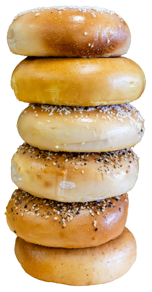 A stack of four bagels with sesame seeds.